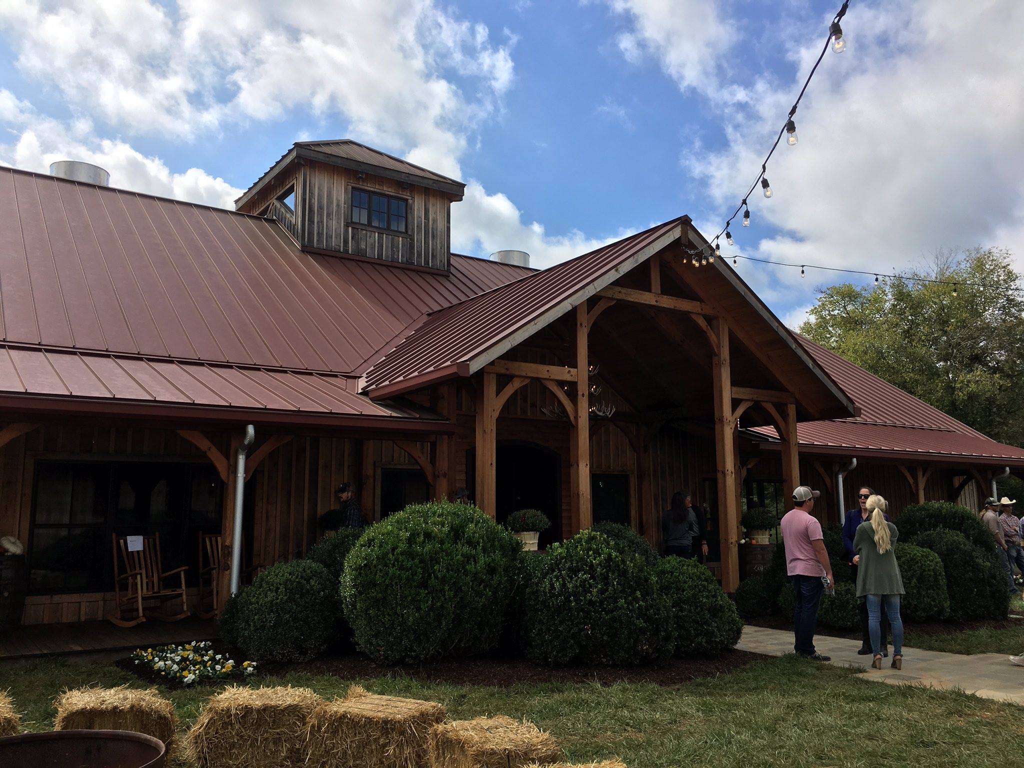 Covered porch and timber posts along the tasting side of the distillery