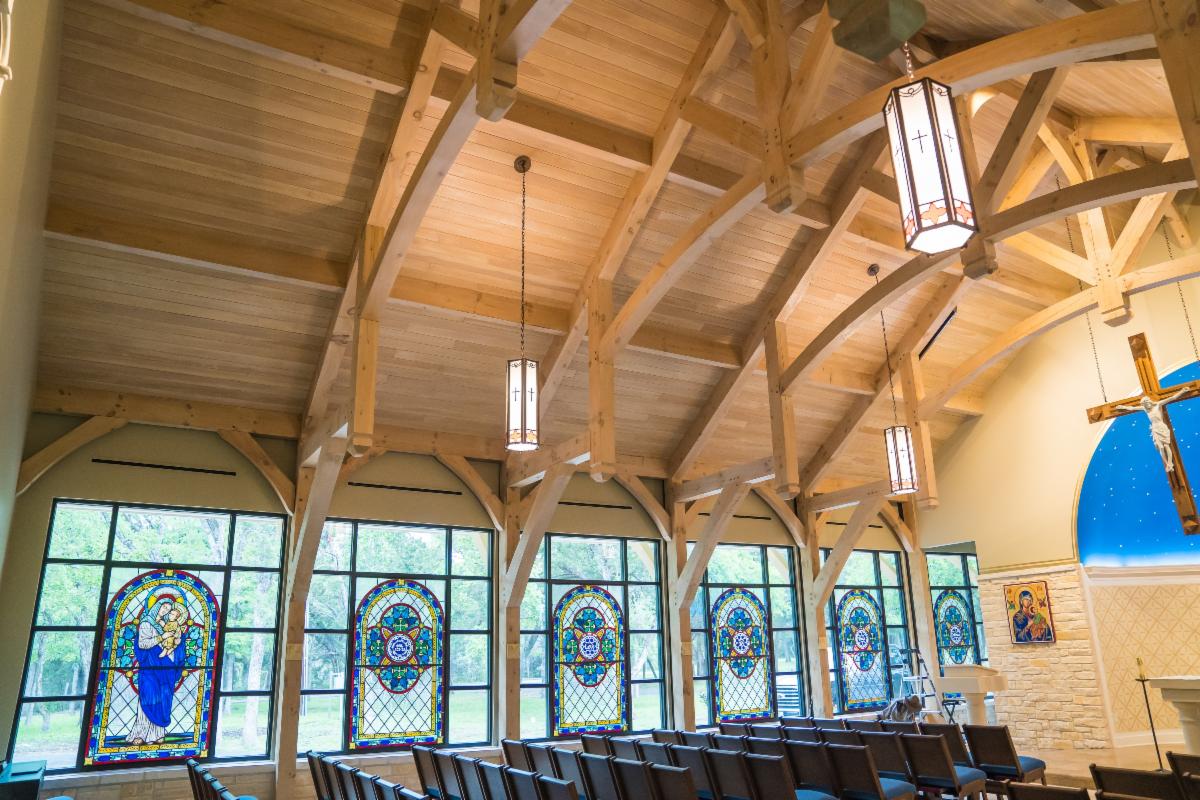 Pegged mortise and tenon joinery at a chapel post-and-beam connection