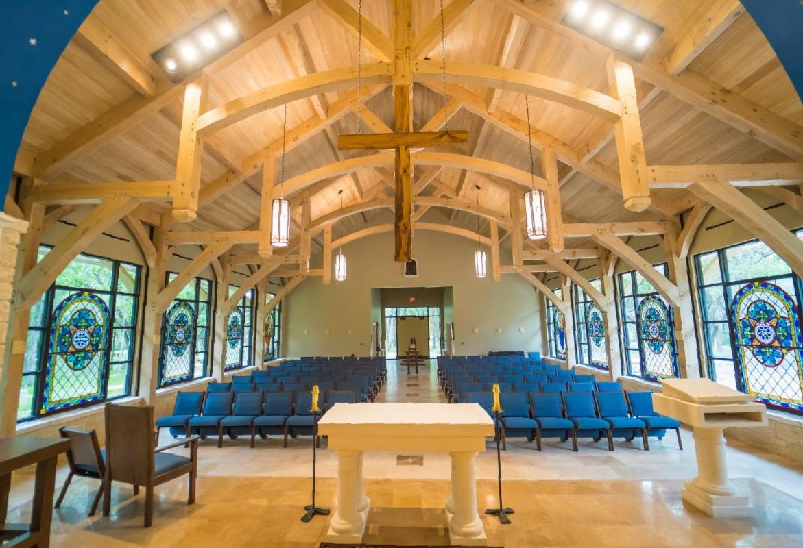 Natural light across the chapel's timber frame and plank ceiling