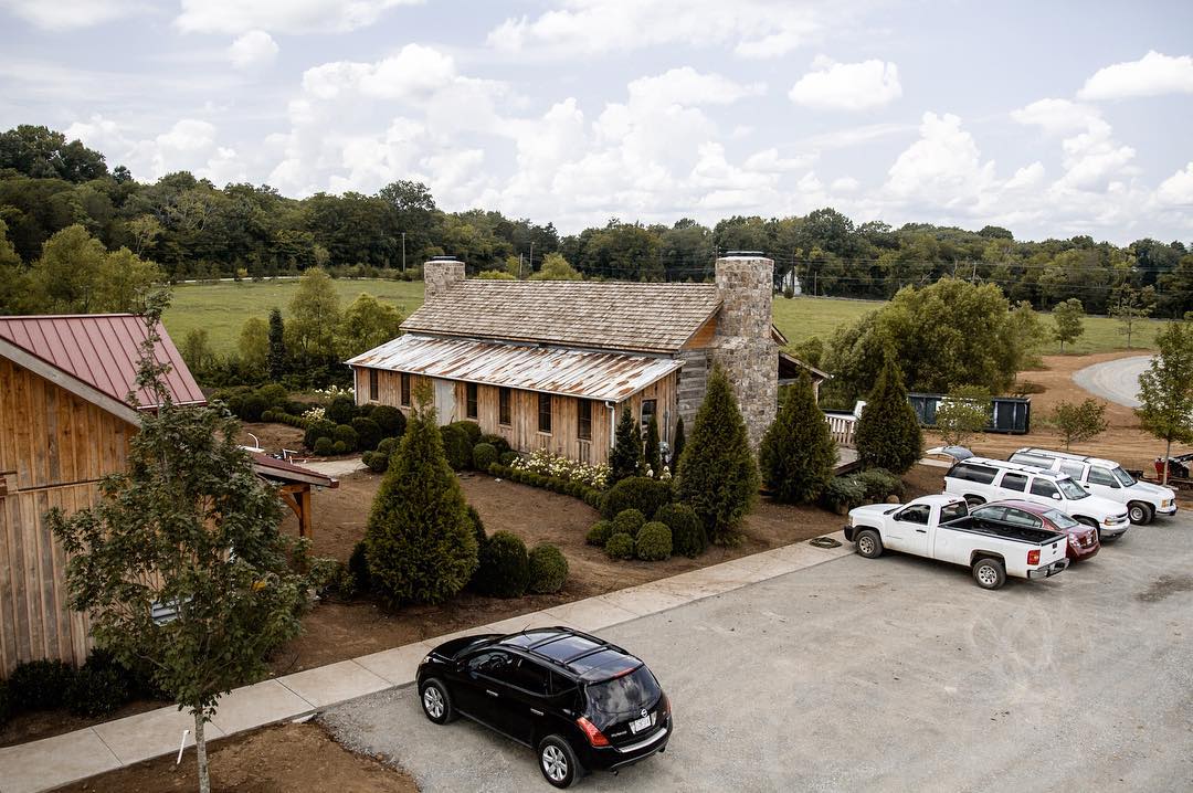 Aerial view of the 5,000-square-foot timber frame distillery on 27 rolling acres outside Leiper's Fork, Tennessee