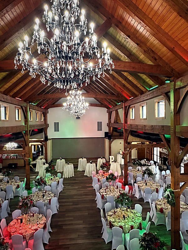 Catalpa Grove timber frame event hall with chandeliers and exposed trusses